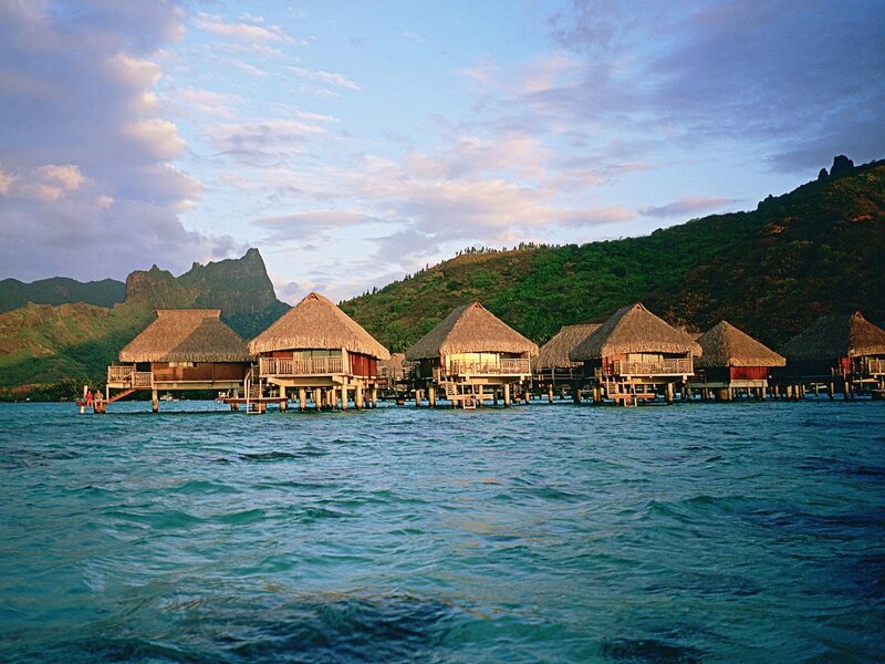 Overwater Bungalows — Blue, Serene, Sunset, Photograph, Thatched Roofs, Mountains
