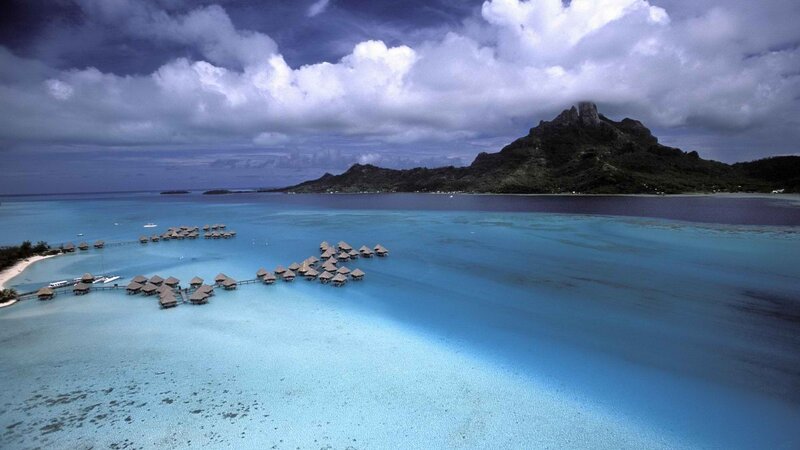 Overwater bungalows in a tropical lagoon