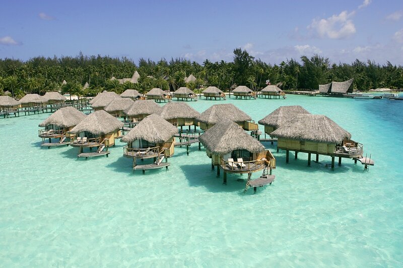 Overwater bungalows in a tropical lagoon