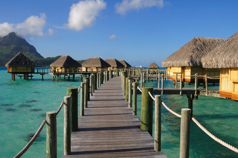 Overwater bungalows in a tropical lagoon