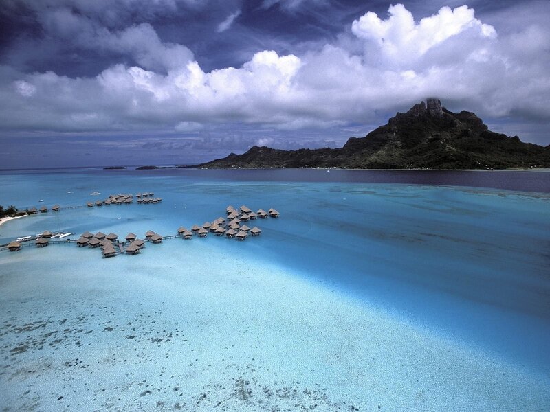 Overwater Bungalows in Lagoon — Blue, Dramatic