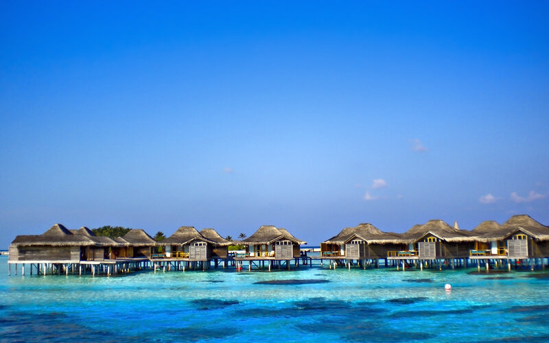 Overwater bungalows in tropical resort