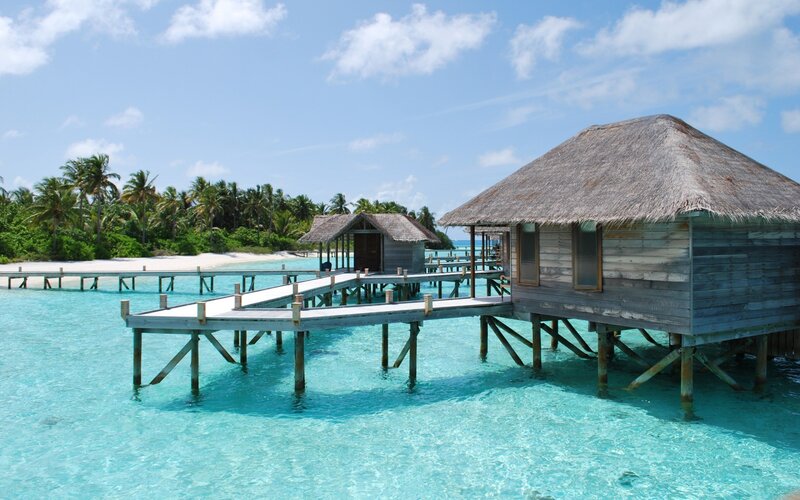 Overwater bungalows in tropical resort