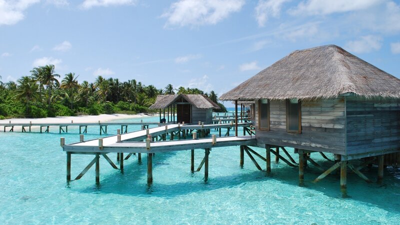 Overwater bungalows in tropical resort