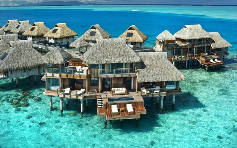 Overwater bungalows in tropical resort