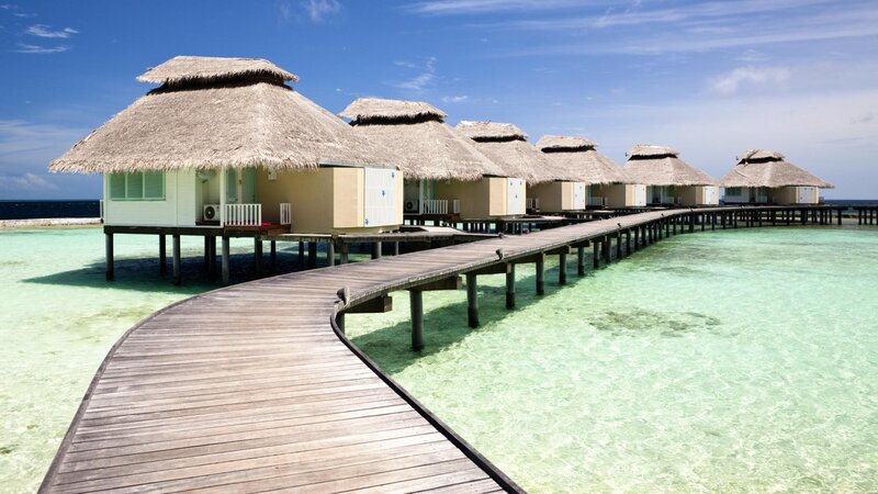 Overwater bungalows in tropical resort
