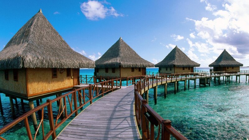 Overwater bungalows in tropical resort