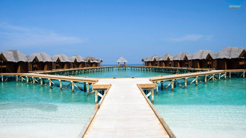 Overwater bungalows in tropical resort