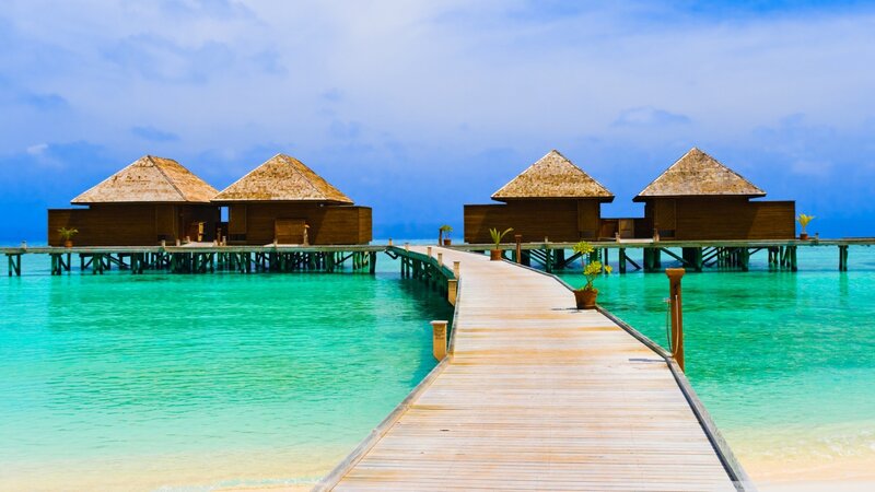 Overwater bungalows in tropical resort