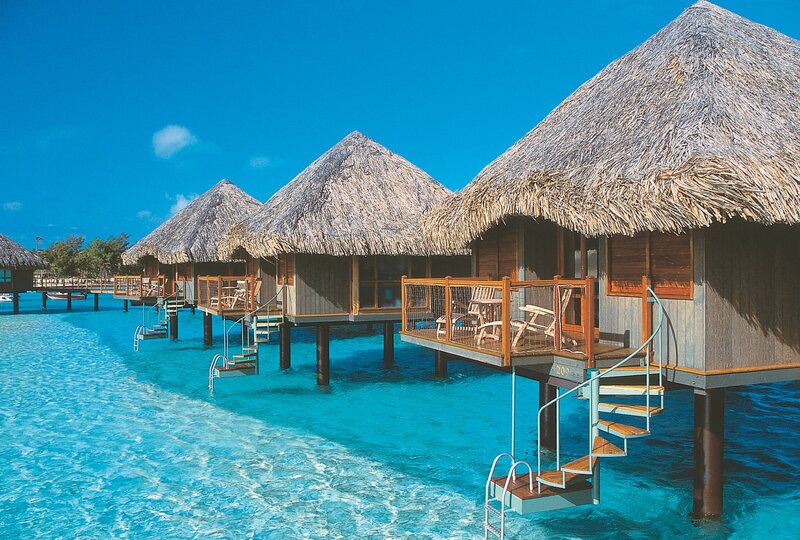 Overwater bungalows in tropical resort