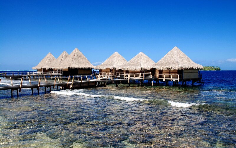 Overwater bungalows in tropical resort