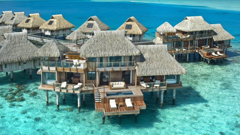 Overwater bungalows in tropical resort