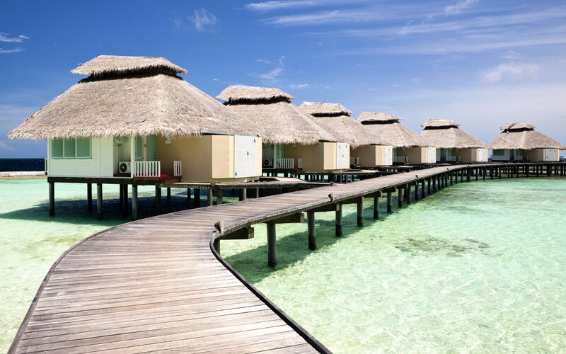 Overwater bungalows in tropical resort