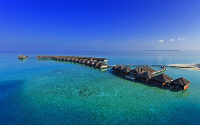 Overwater bungalows in tropical resort