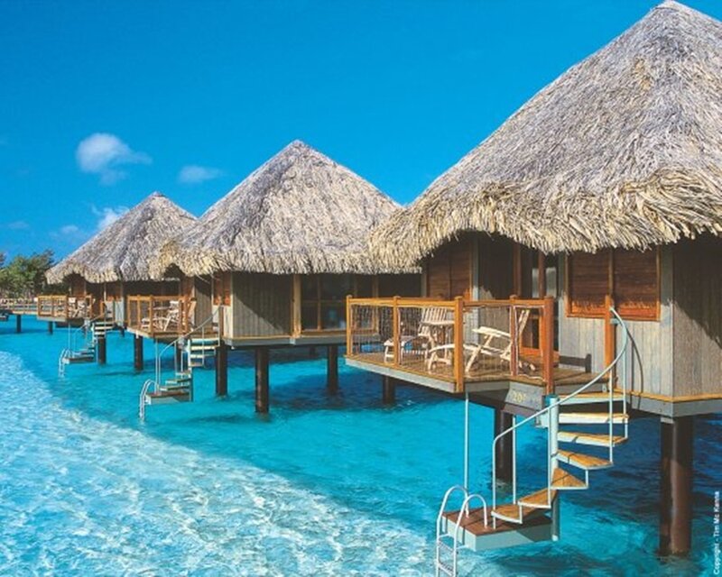 Overwater bungalows in tropical resort