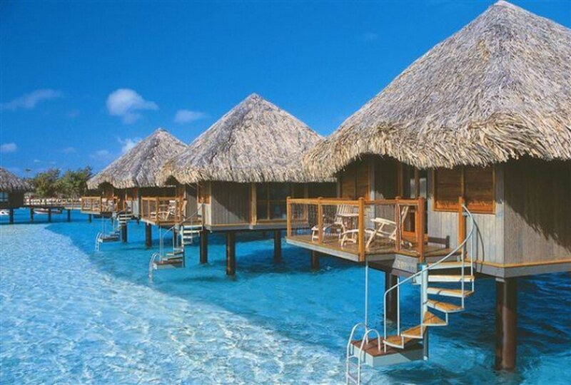 Overwater bungalows in tropical resort