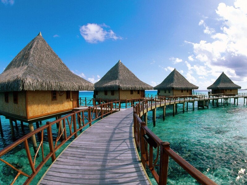 Overwater bungalows in tropical resort