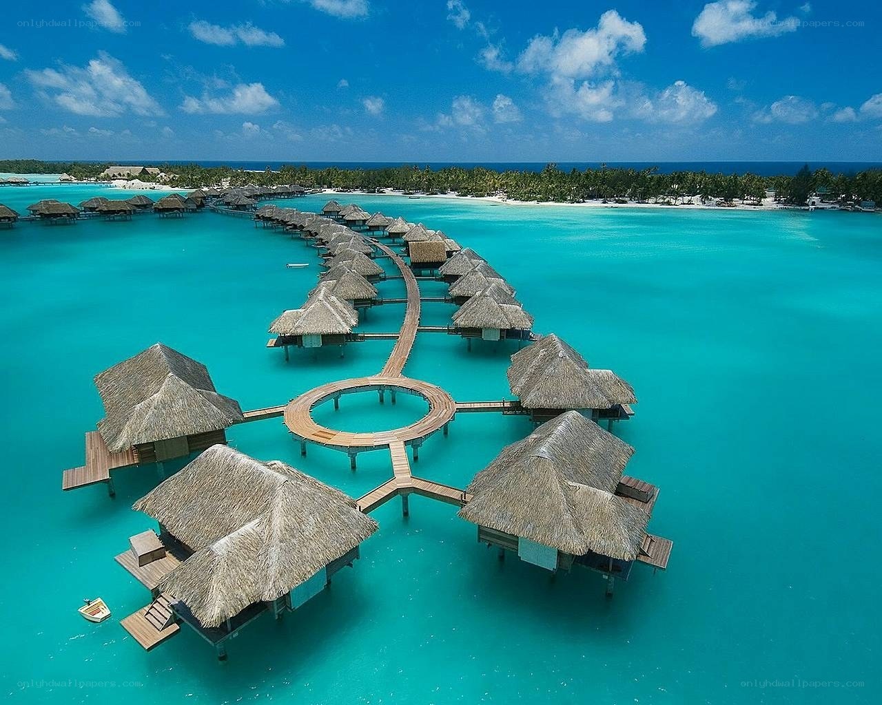 Overwater bungalows in tropical resort