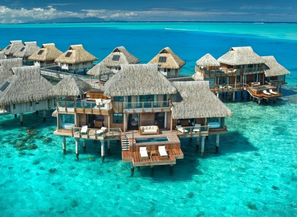 Overwater bungalows in turquoise lagoon
