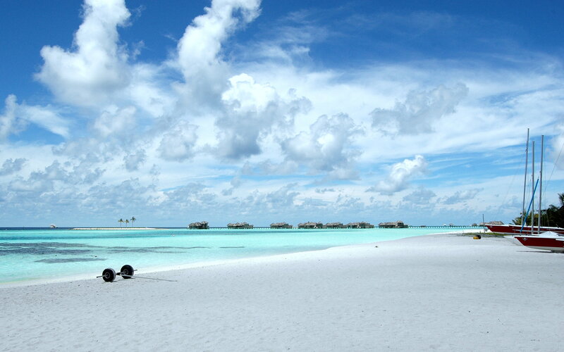 Overwater Bungalows on Beach — Blue, Serene, Afternoon, Photograph