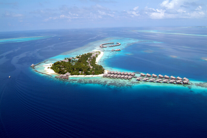 Overwater Bungalows on Island — Blue, Serene, Afternoon, Photograph