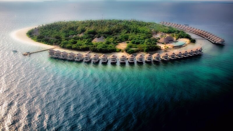 Overwater Bungalows on Island — Blue, Serene, Sunset
