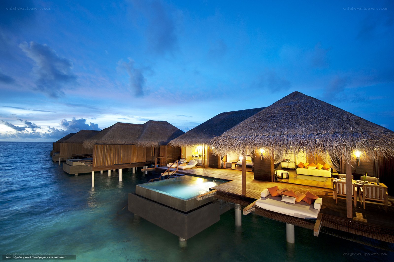 Overwater villas at dusk