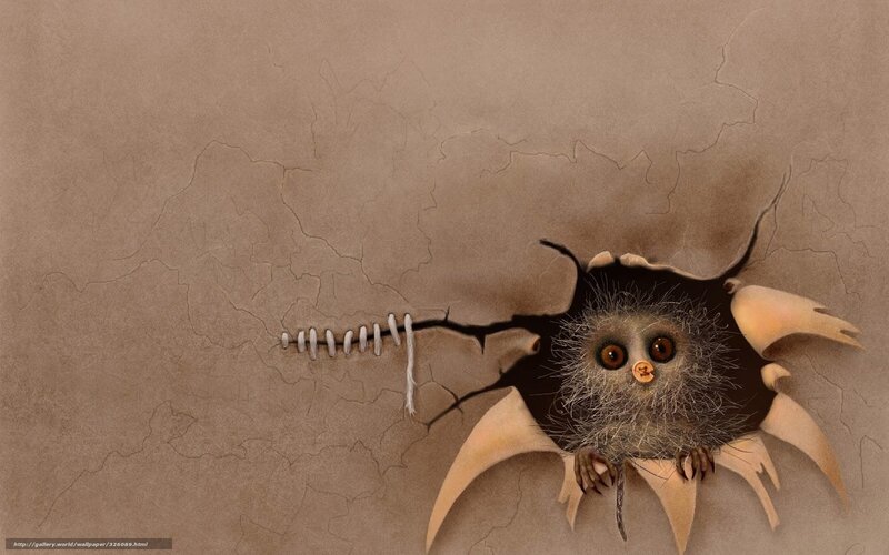 owl peeks through torn paper