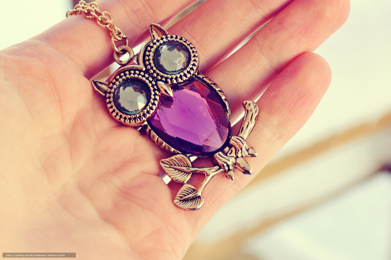 Owl pendant in hand