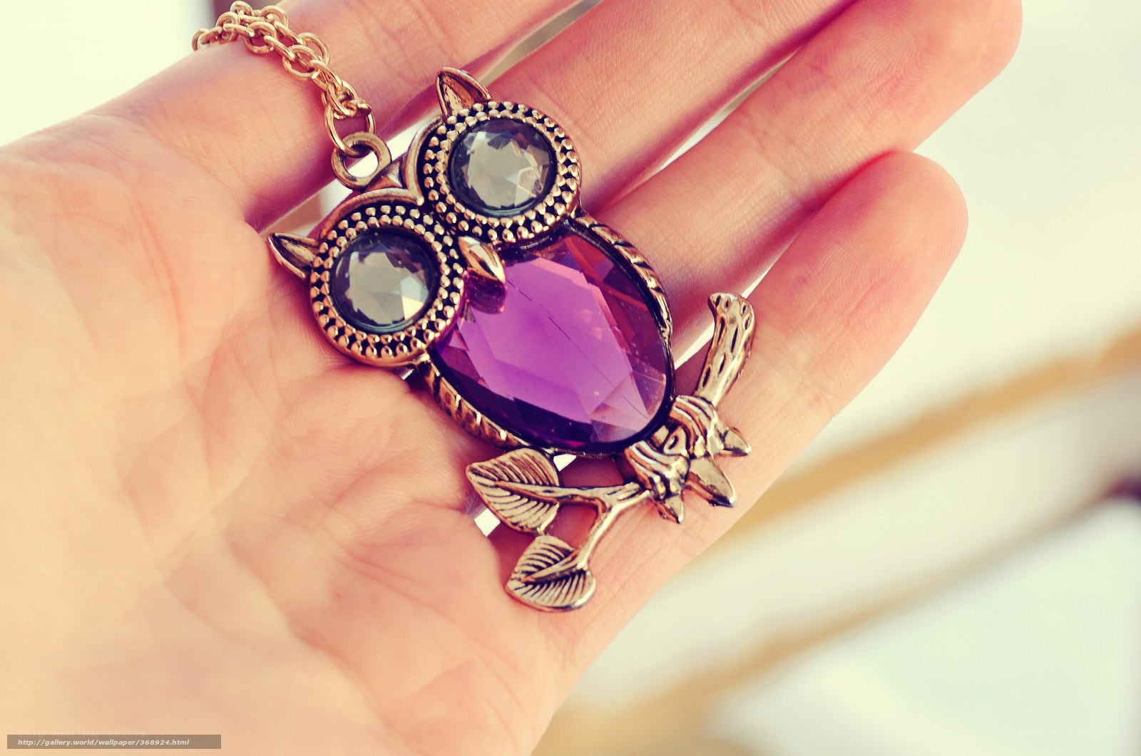 Owl pendant in hand