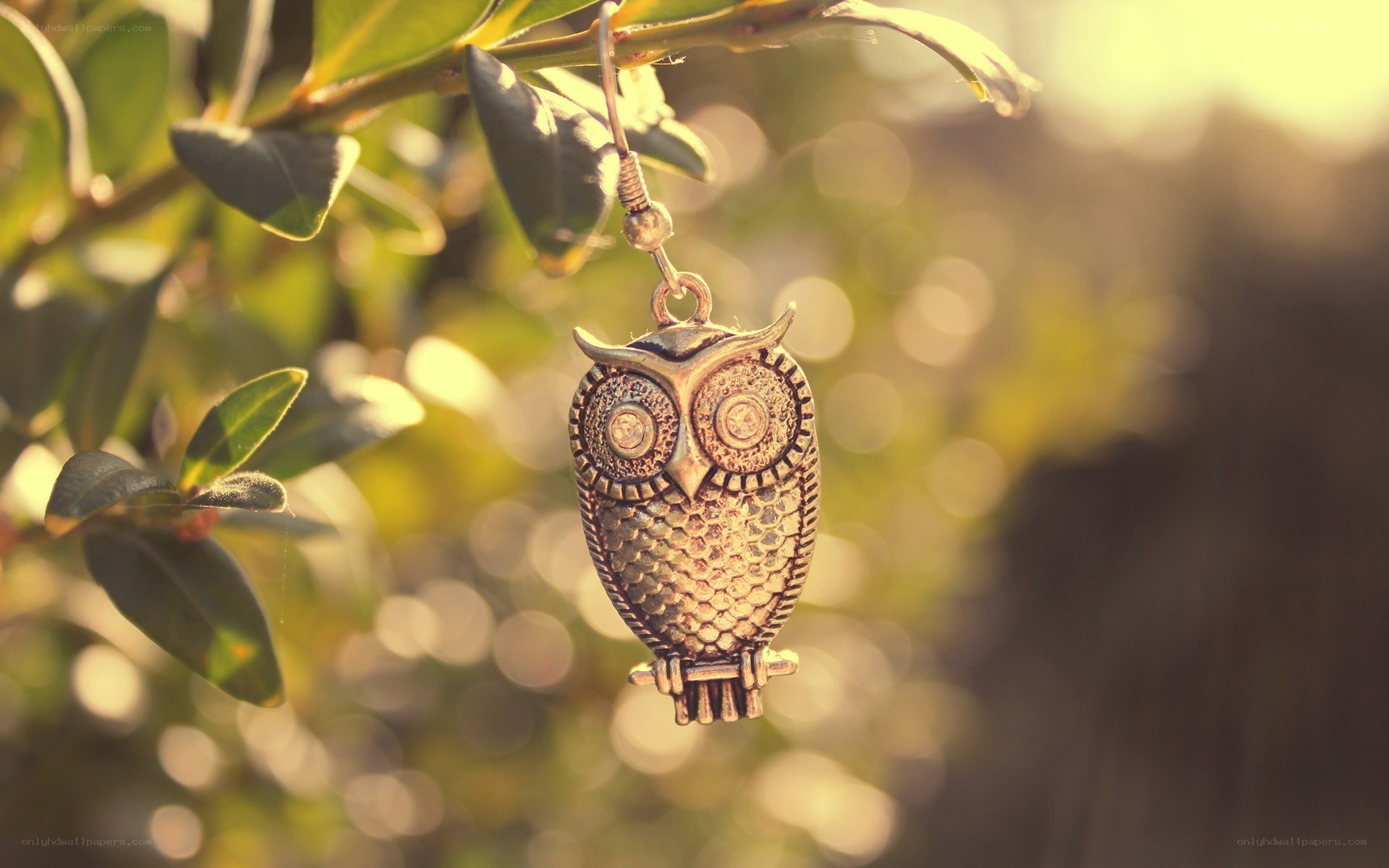 Owl pendant on a branch