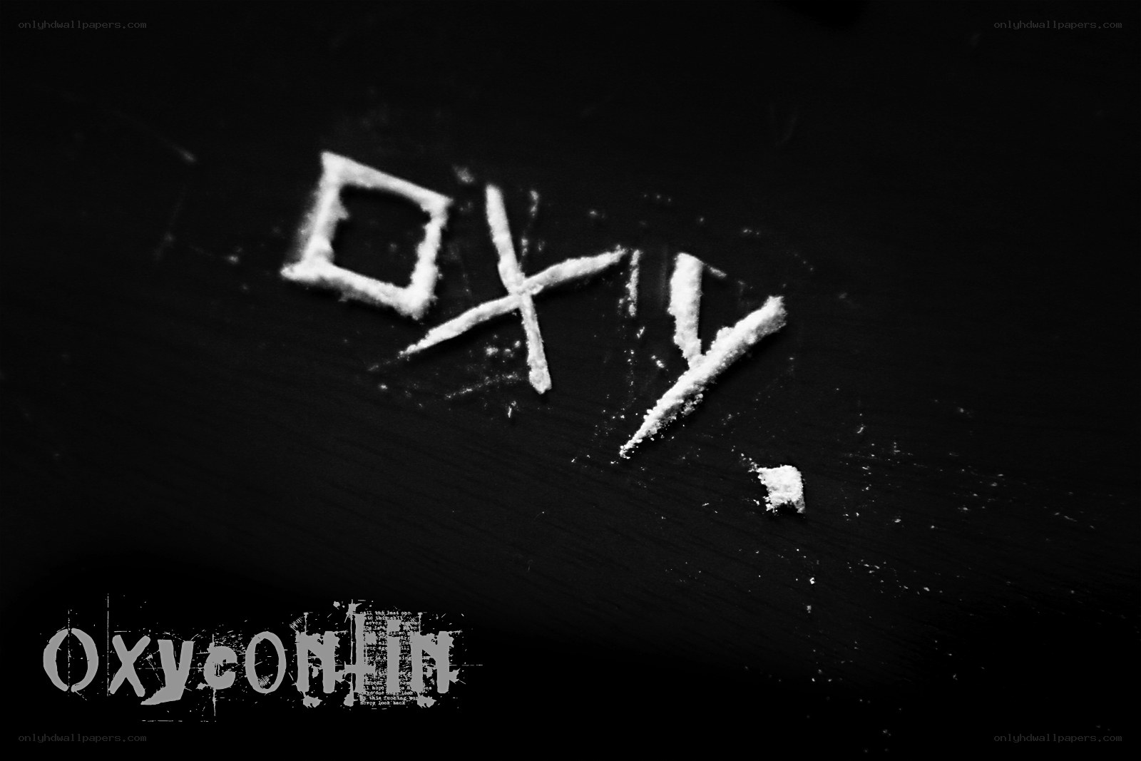 Oxy written in white powder