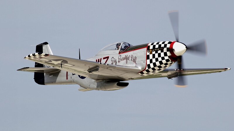P-51 Mustang Airplane — Gray, Dynamic, Photograph, Propeller, Checkered Pattern, Cockpit