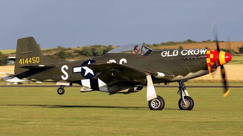 P-51 Mustang on a grass runway