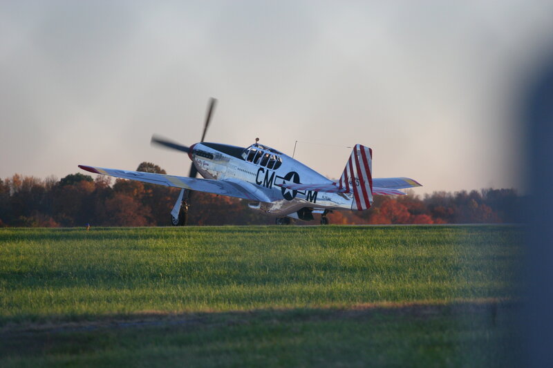 P-51 Mustang on a grass runway