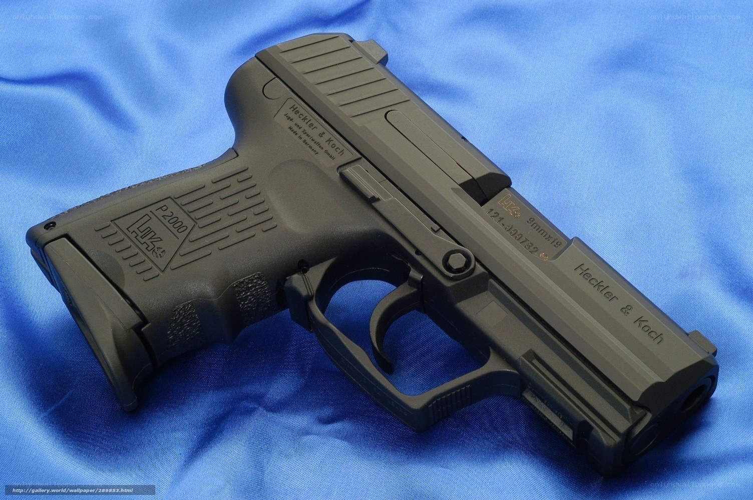 P2000 pistol on blue cloth
