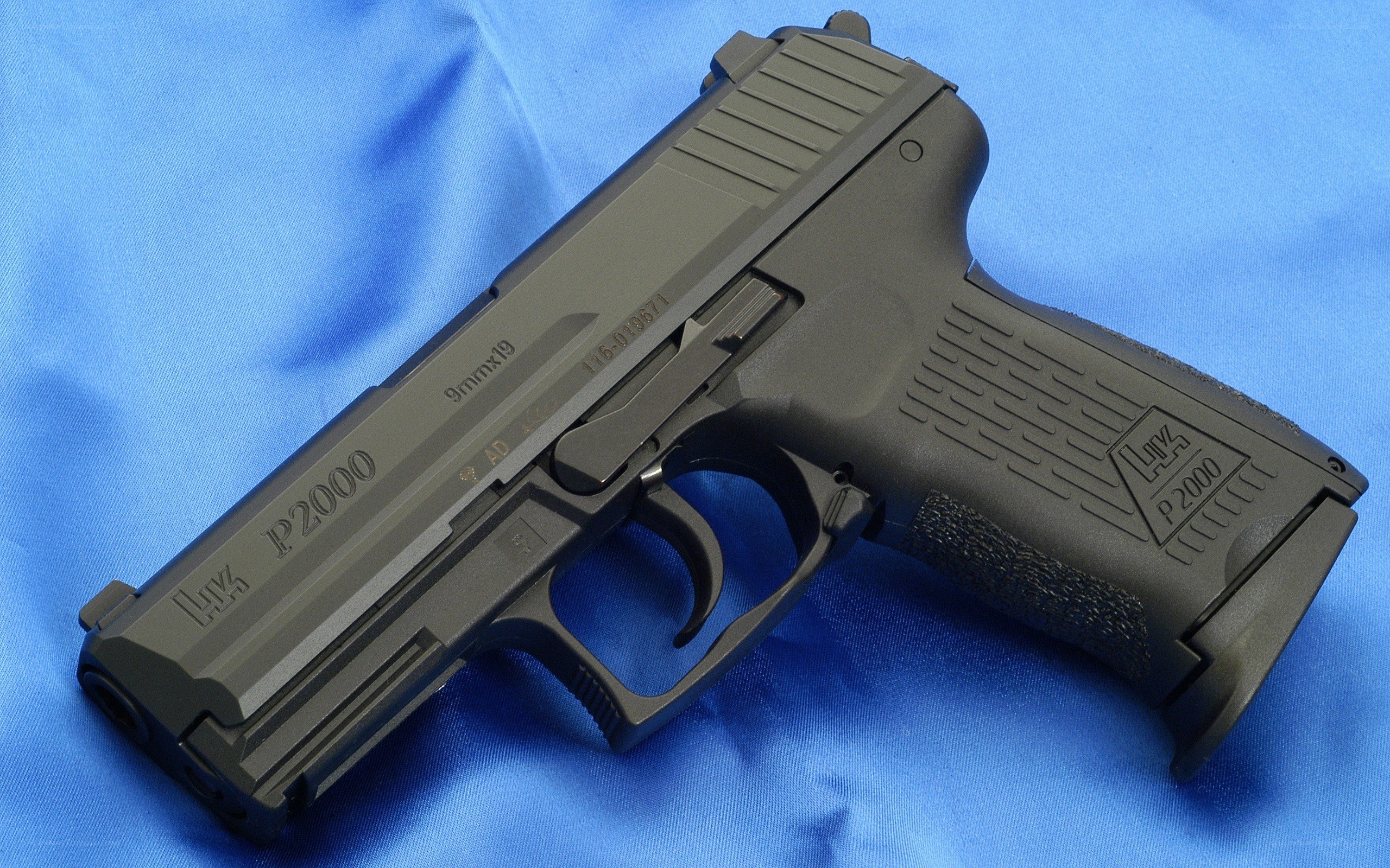 P2000 pistol on blue cloth