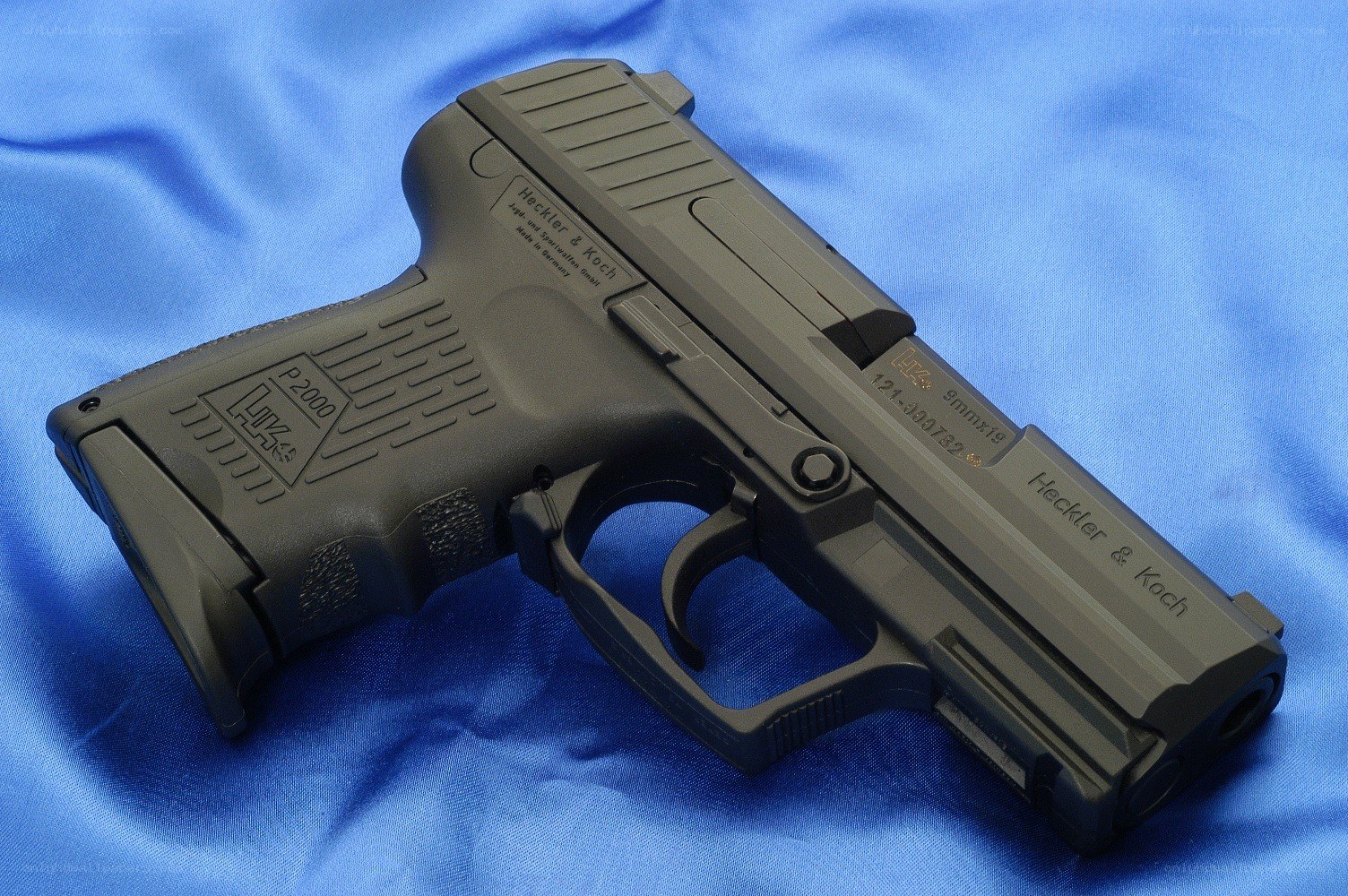 P2000 pistol on blue cloth