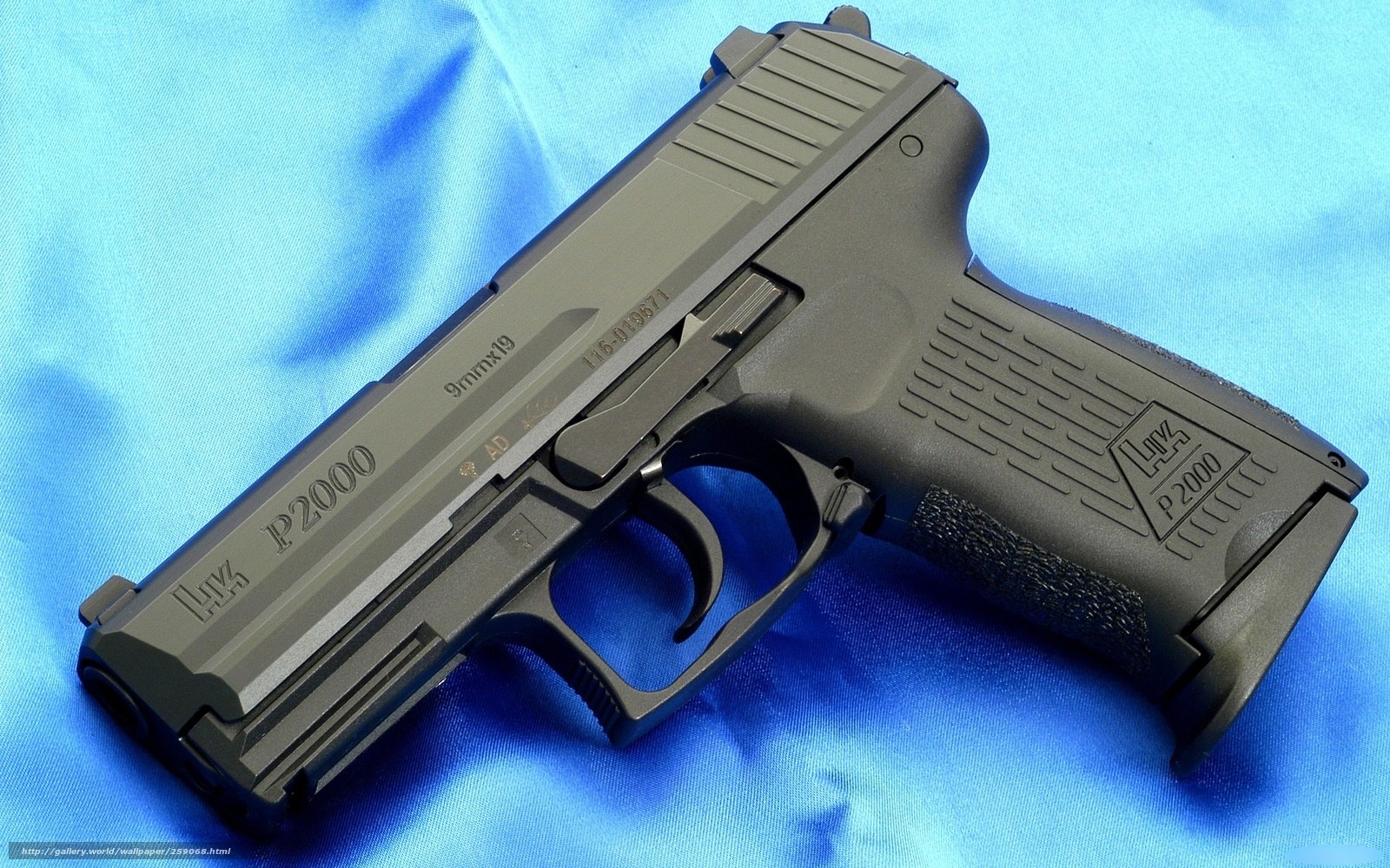 P2000 pistol on blue cloth