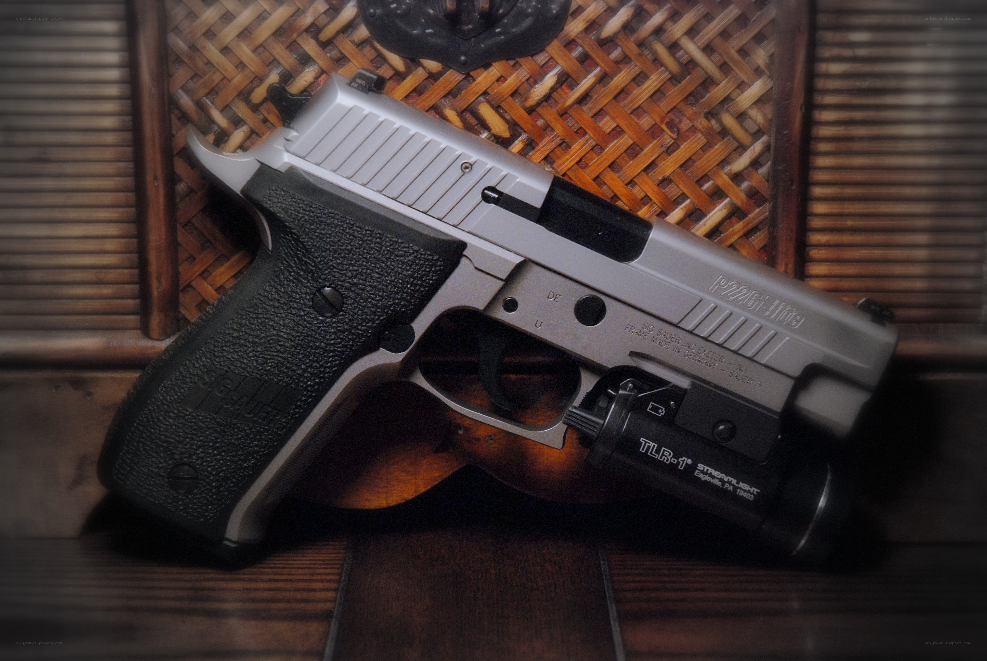p220 pistol with flashlight