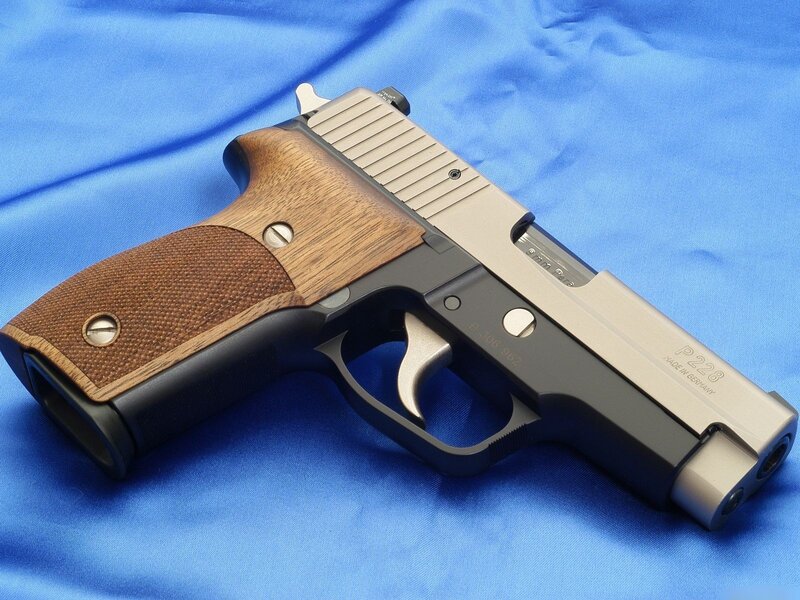 p228 pistol with wooden grips