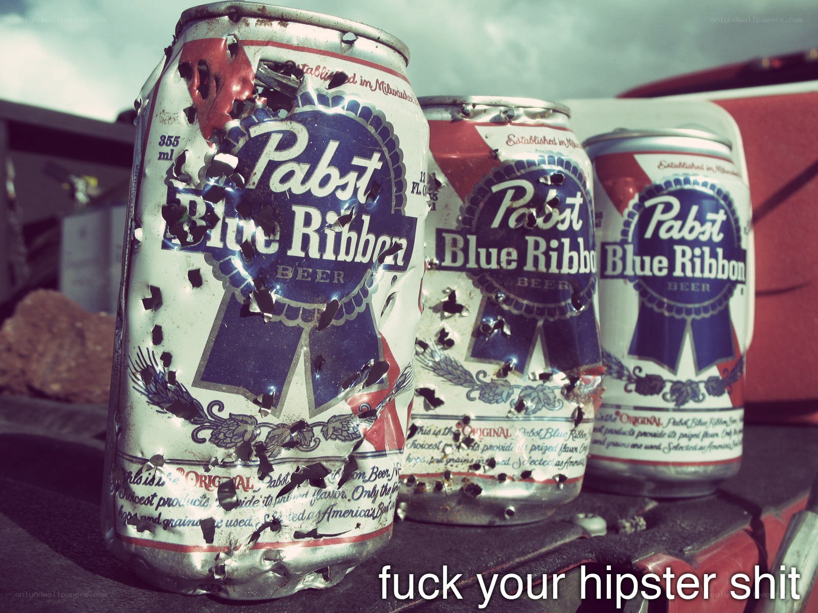 Pabst Blue Ribbon cans with text