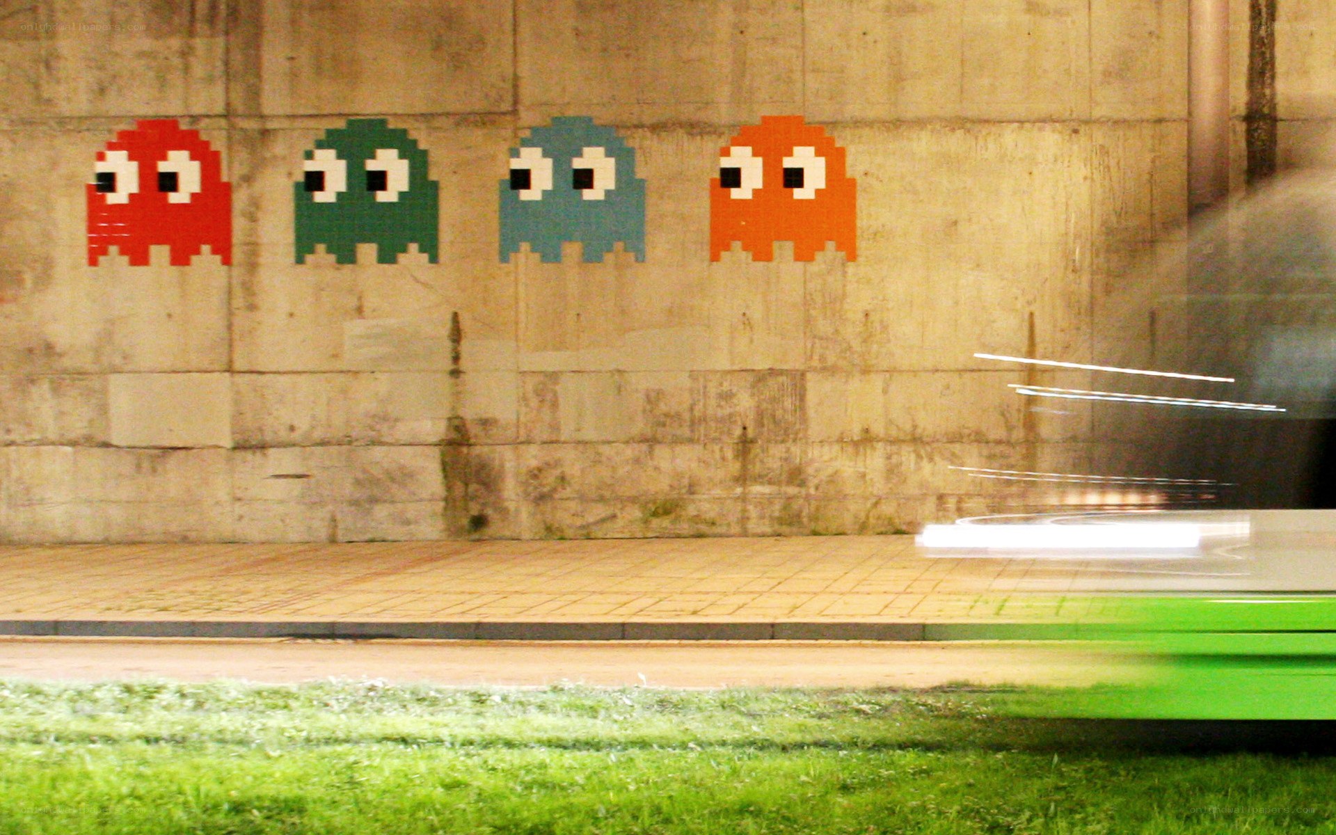 Pac-Man ghosts on concrete wall
