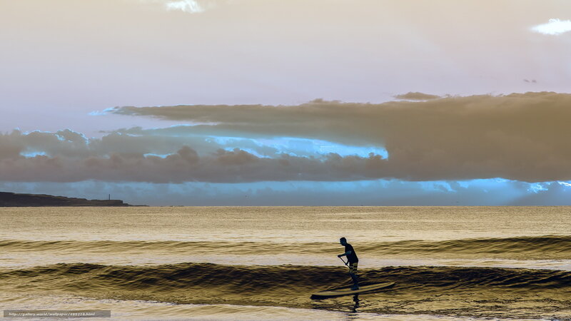 Paddleboarder at sunset
