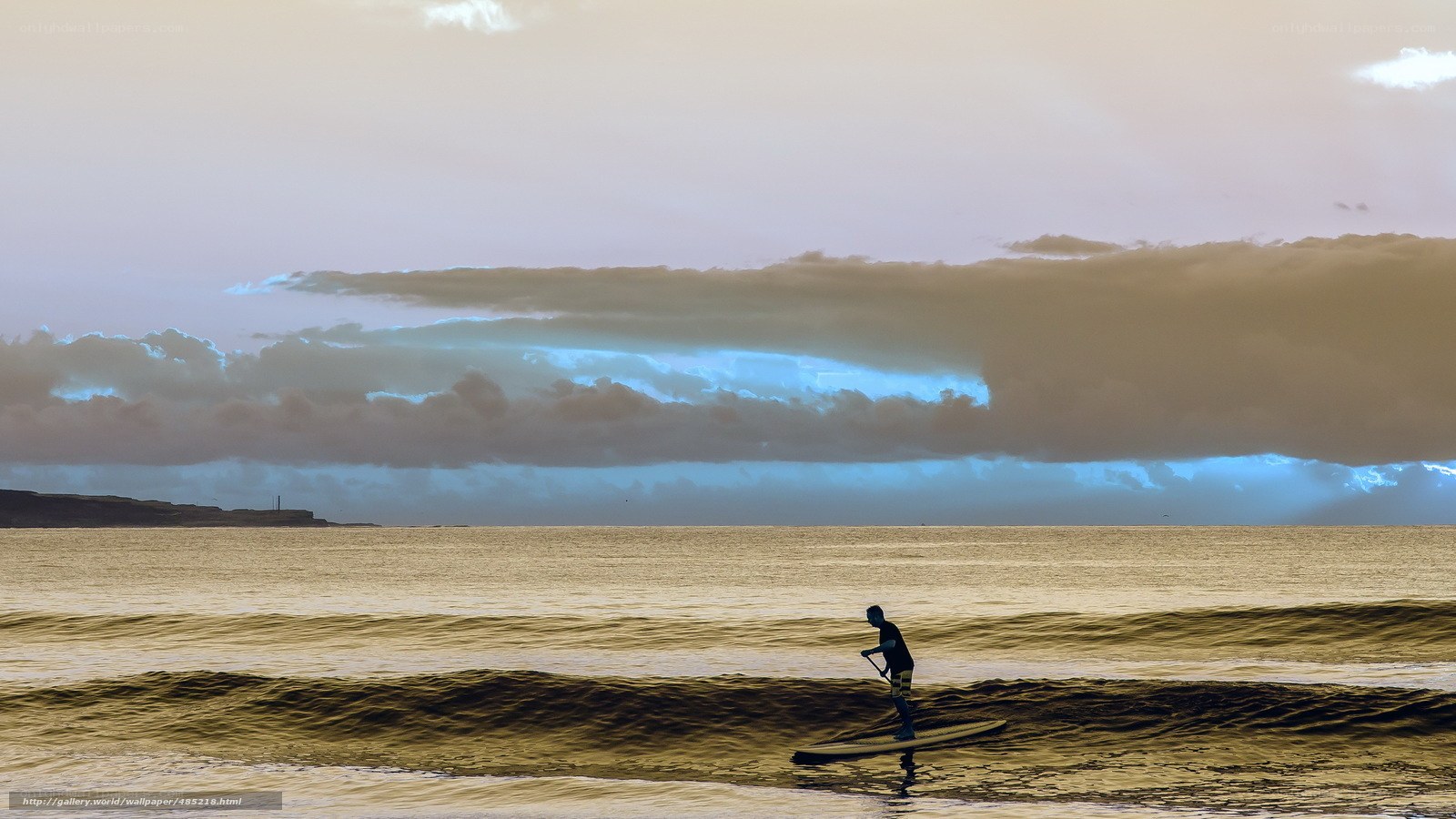 Paddleboarder at sunset