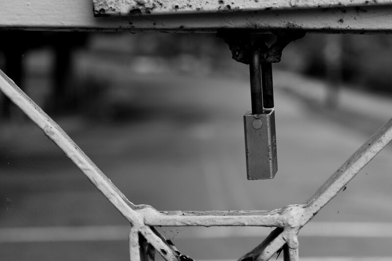 Padlock on Metal Gate — Black