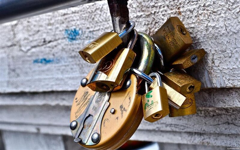 Padlocks on Metal Bar