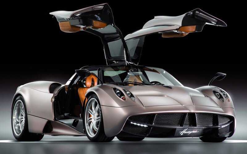 Pagani Huayra Sports Car — Silver, Dramatic, Photograph, Open Doors, Orange Interior