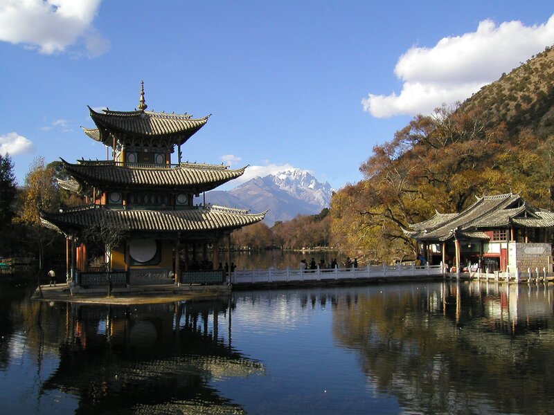 Pagoda by a lake with mountain view