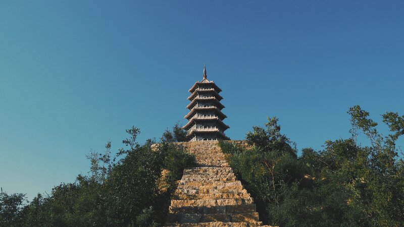 Pagoda on a hill under blue sky